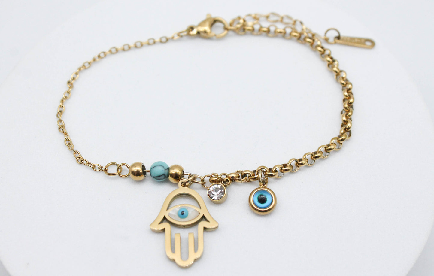 PULSERA MANO DE FATIMA MITAD DELGADA/ MITAD GRUESA ESFERA AZUL, CIRCONIA OJO COLGANDO,18CM + EXTENSION 4CM