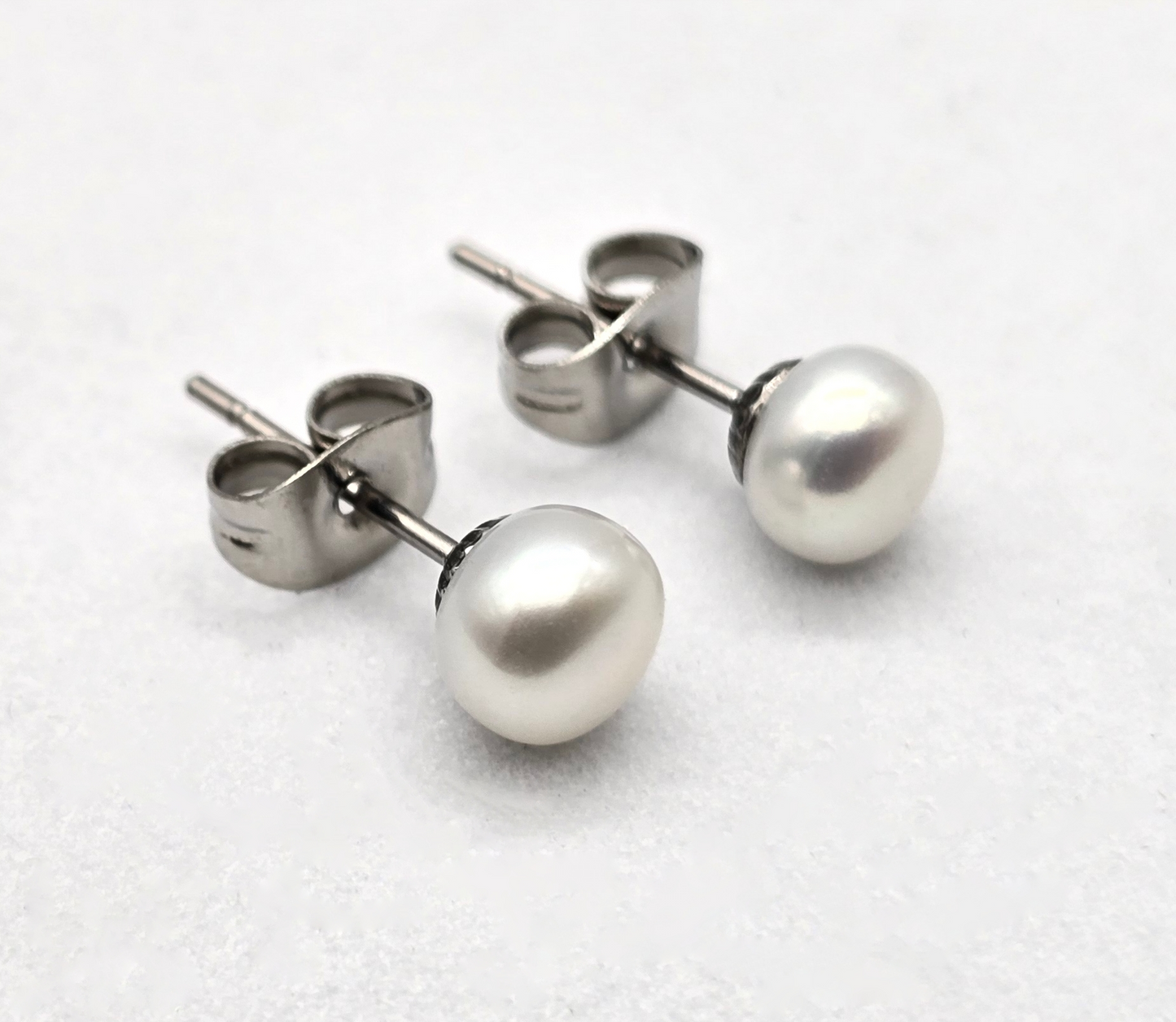 BROQUEL PERLA DE RIO 6MM; POSTE TONO PLATEADO