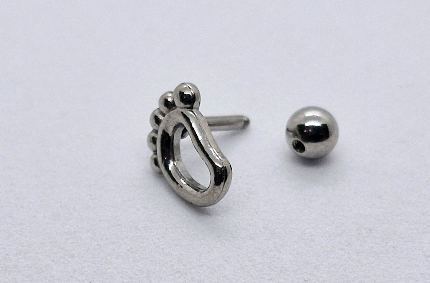 PIERCING PIE; TONO PLATEADO
