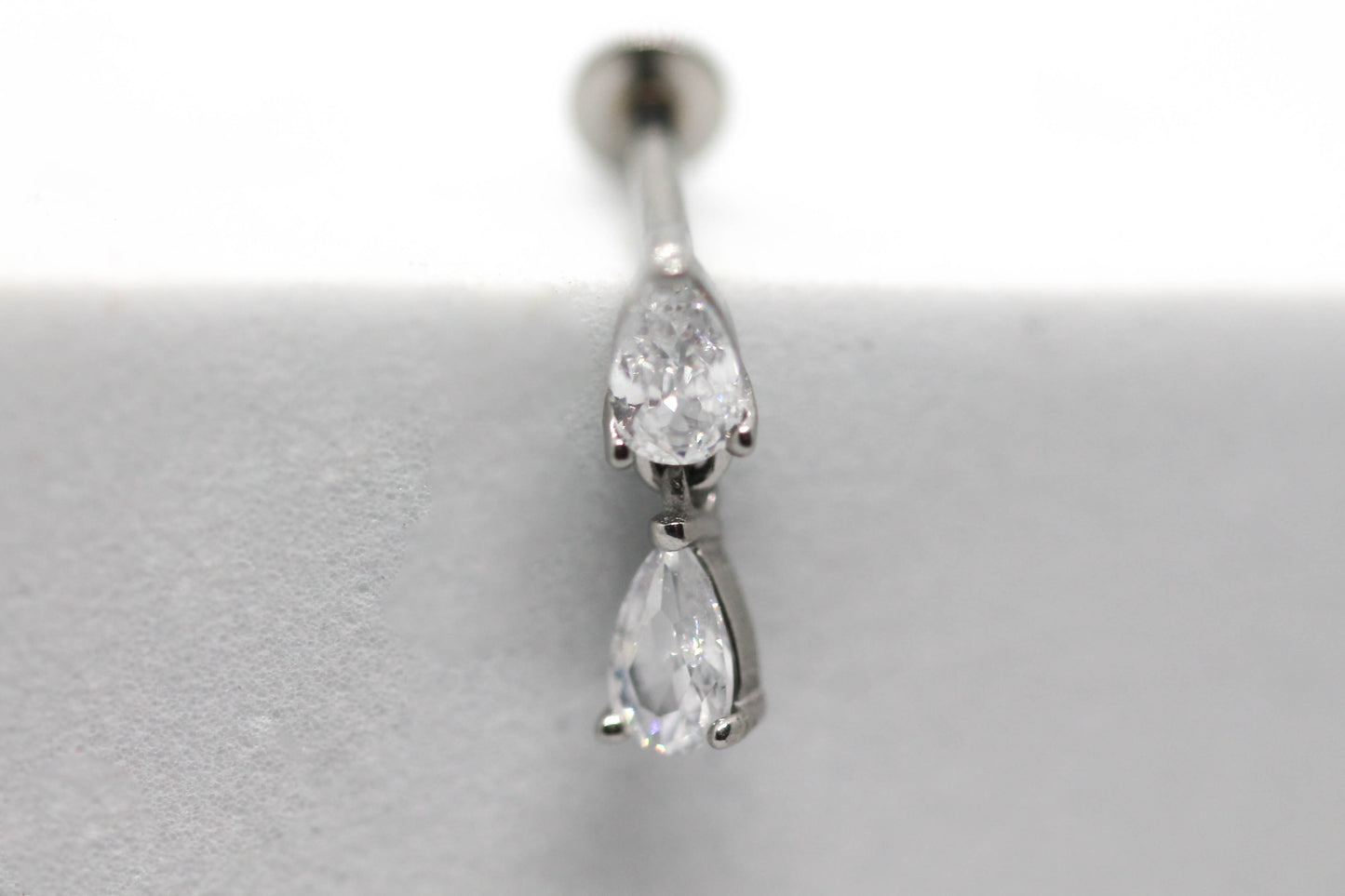 PIERCING DOBLE GOTA CIRCONIA; TONO PLATEADO