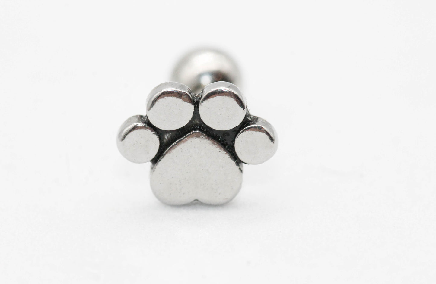 PIERCING HUELLA DE PERRO 8MM, TONO PLATEADO