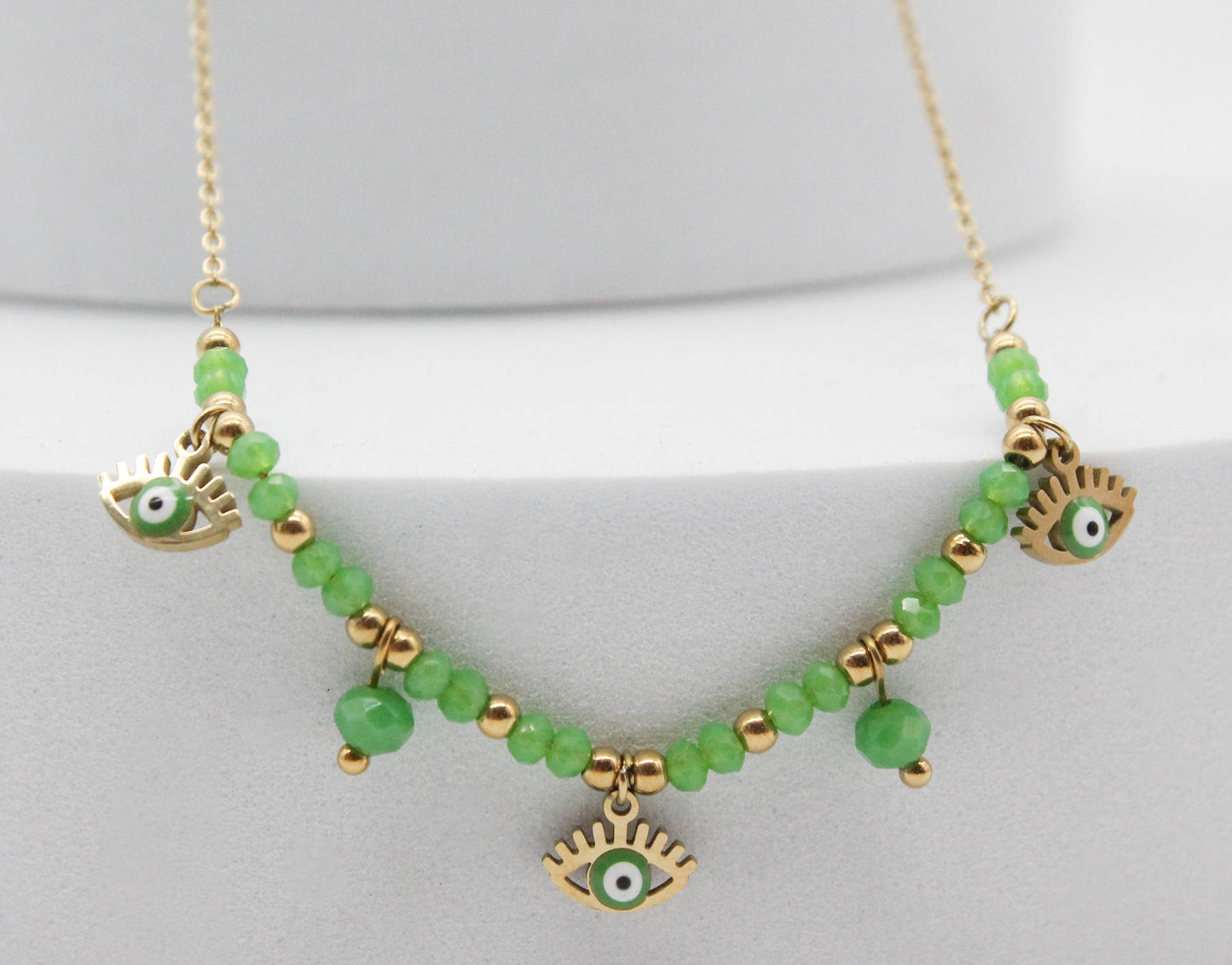 COLLAR 3 OJOS VERDES PESTAÑAS 8MM, DOS CRISTALES 5MM COLGANDO 40CM + EXTENSION DE 5CM