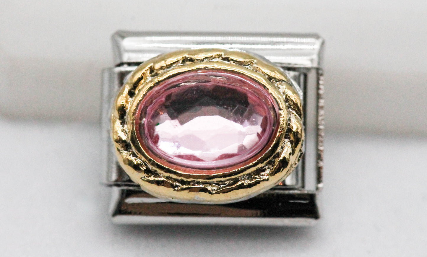 CHARM OVALO CIRCONIA ROSA SILUETA DORADA PULSERA ITALIANA