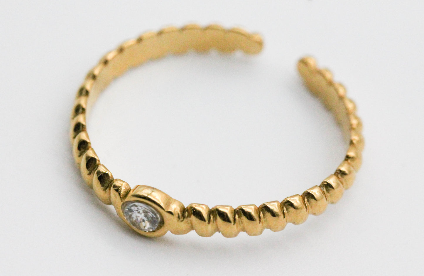 ANILLO AJUSTABLE SOLITARIO CUERDA, TONO DORADO