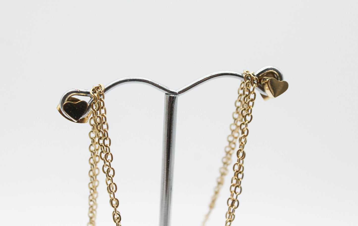 SET DOBLE CORAZON CIRCONIA 11MM CORAZON MINI 4MM BROQUELES 4MM; CADENAS 30 y 40CM; TONO DORADO