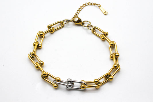 PULSERA ESLABONES ESCALONADOS TFY; TONO DORADA Y PLATEADA