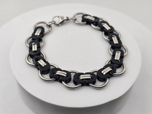 PULSERA CABALLERO ESTILO BIZANTINO AROS 15MM; 21CMS LARGO; TONOS PLATEADO Y NEGRO