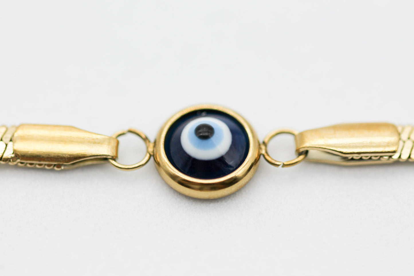 PULSERA PLANCHADA, OJO TURCO  8MM AZUL 16.5CM + EXTENSION 3CM, TONO DORADO