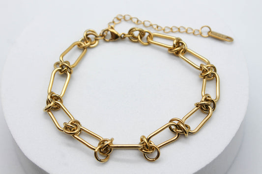 PULSERA ESLABON ESCALONADO CON NUDO 18CM + EXTENSION 6.5CM; TONO DORADO