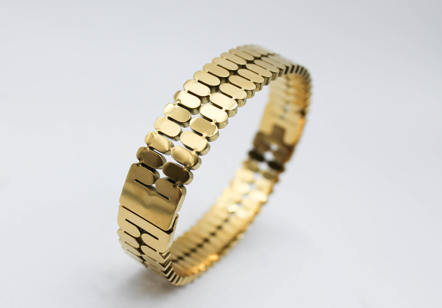 BRAZALETE RIGIDO DOBLE OVALOS 13MM DE GROSOR; TONO DORADO