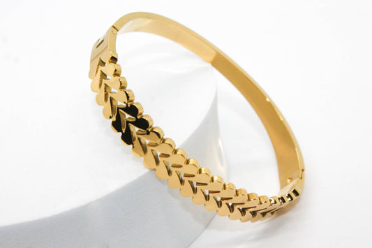 BRAZALETE RIGIDO ESPIGAS; TONO DORADO