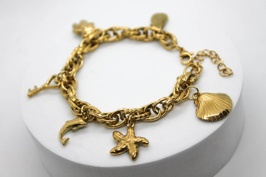 PULSERA DIJES COLGANTES PIÑA, OSO, LLAVE, DELFIN, ESTRELLA DE MAR, CONCHA; TONO DORADO