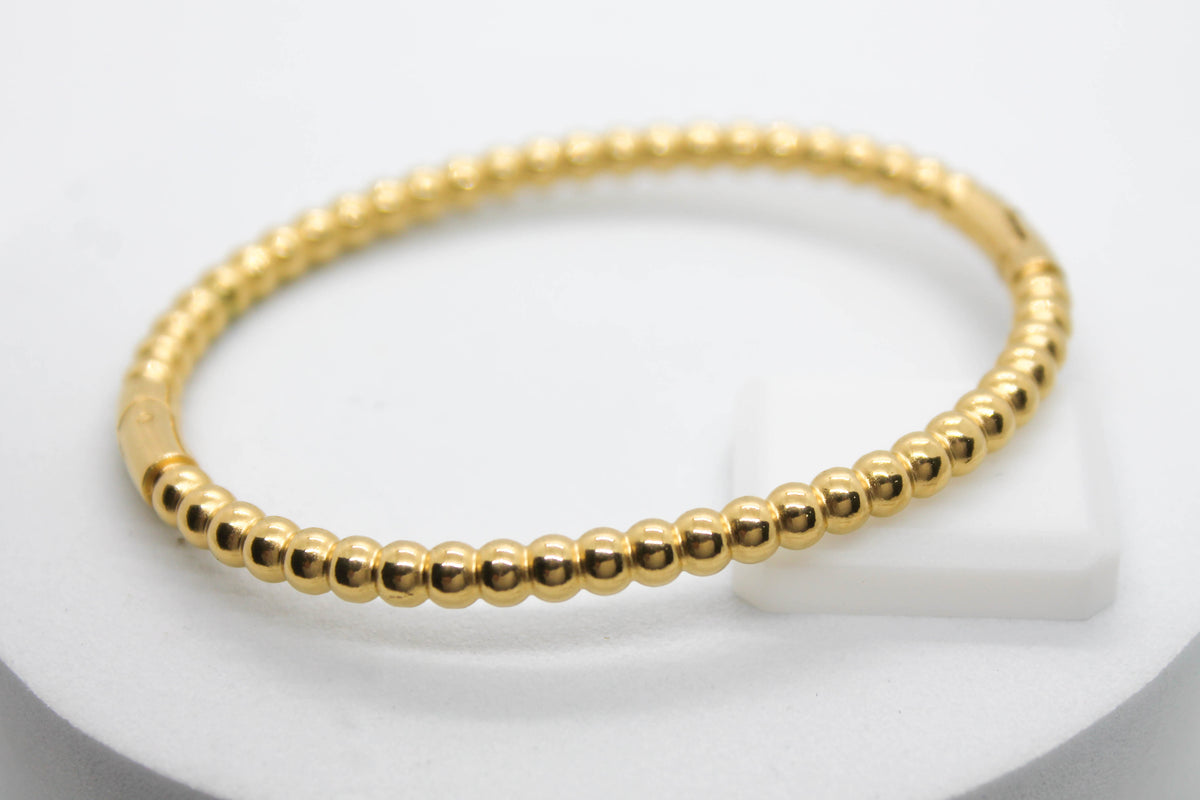 BRAZALETE ESFERITAS; TONO DORADO
