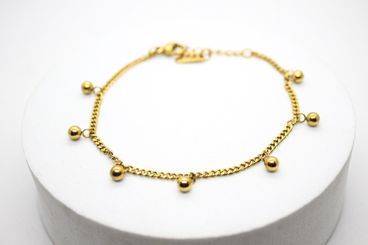 PULSERA CADENA BARBADA ESFERAS; TONO DORADO