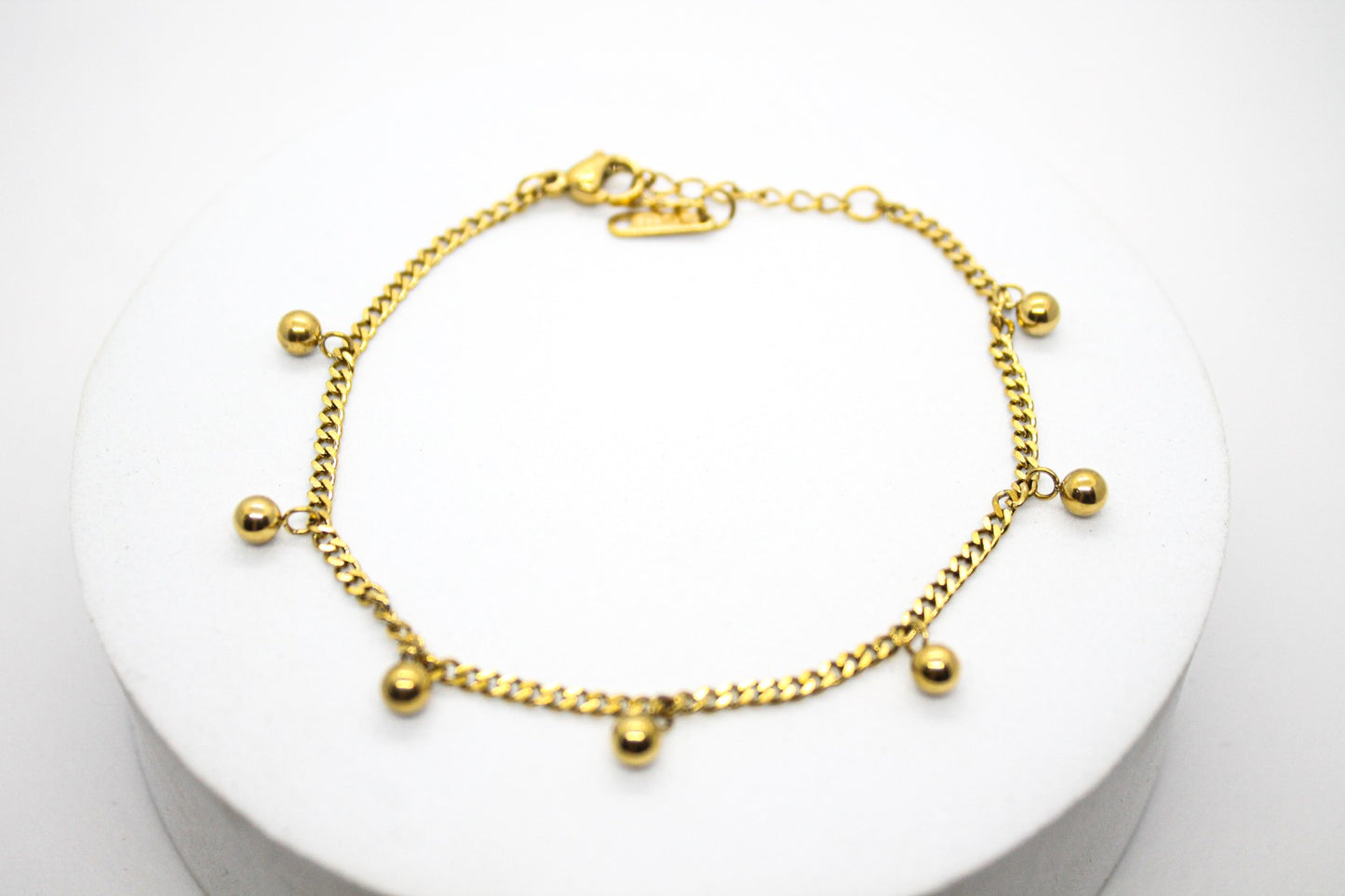 PULSERA CADENA BARBADA ESFERAS; TONO DORADO