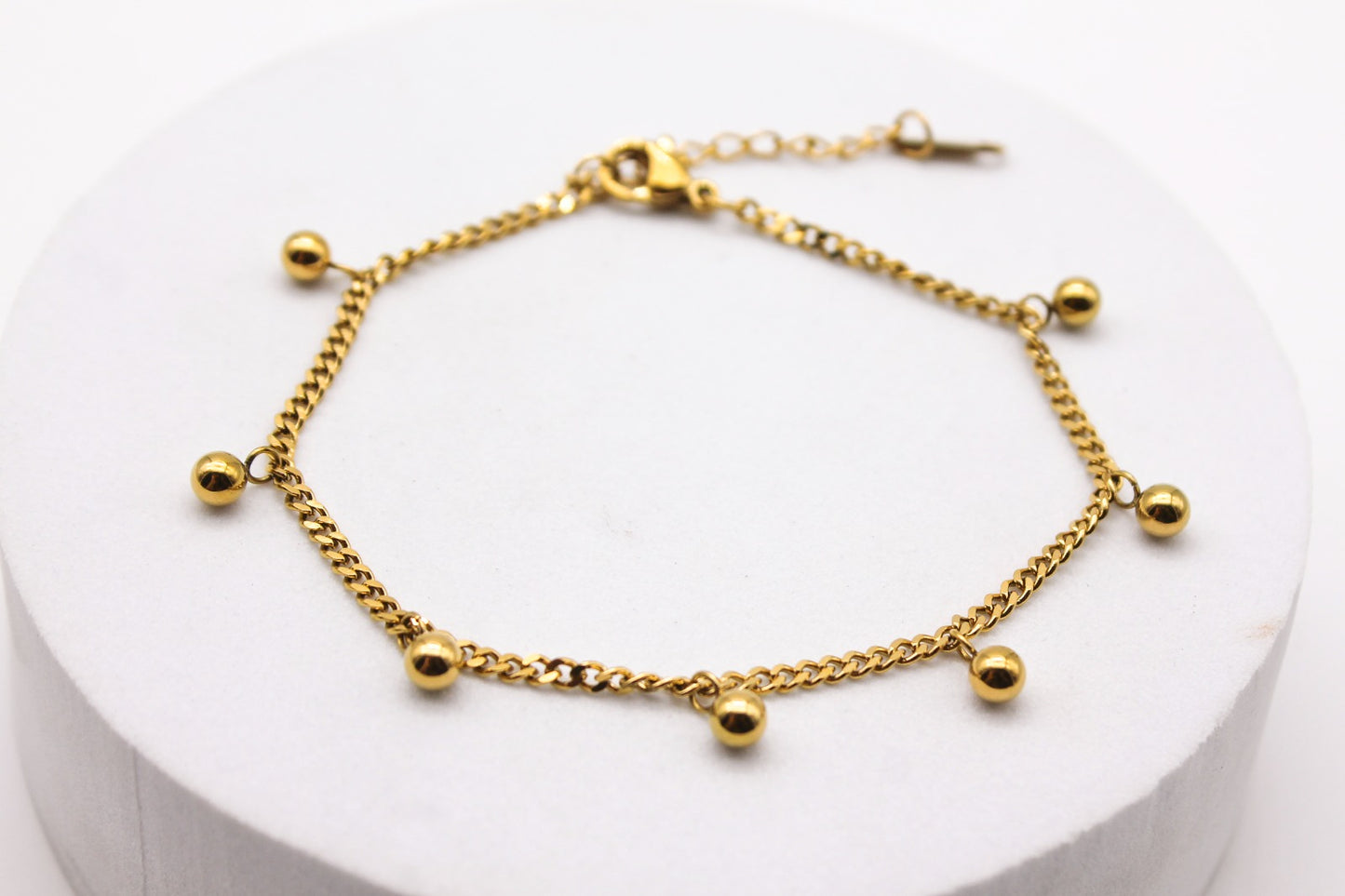 PULSERA CADENA BARBADA ESFERAS; TONO DORADO