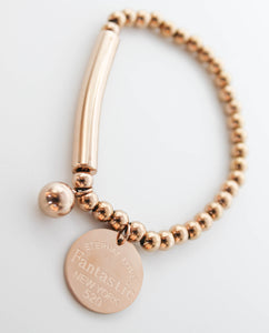 PULSERA ELASTICO ESFERAS, BARRA Y MEDALLA "FANTASTIC", TONO ROSA