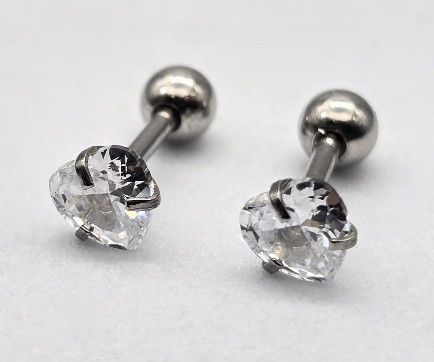 BROQUEL CIRCONIA CORAZON 5 MM CON TOPE DE ROSCA; TONO PLATEADO
