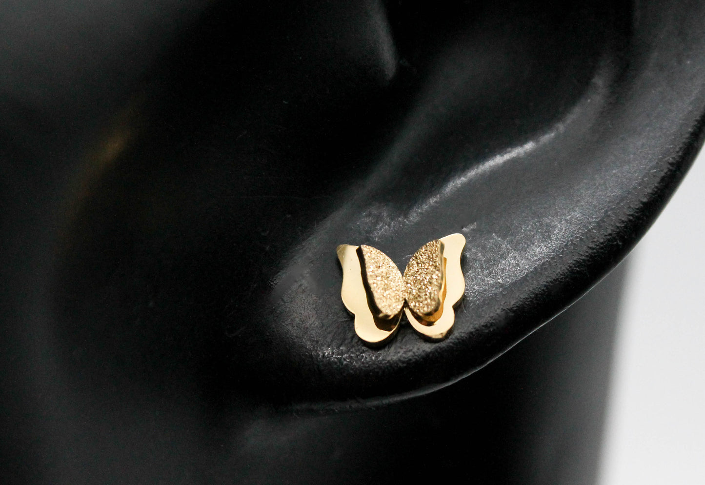 BROQUELES MARIPOSA DOBLE TEXTURA AZUCARADA, TONO DORADO 7MM