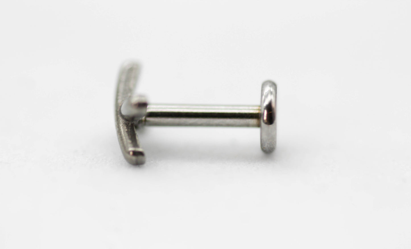 PIERCING "X" LISO  6MM; TONO PLATEADO