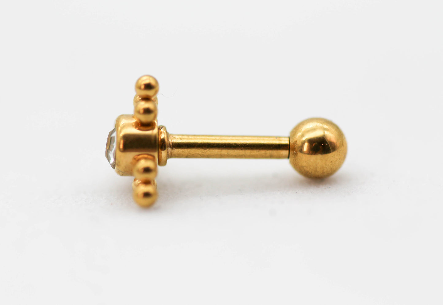 PIERCING TRIANGULAR, MINI ESFERAS, CIRCONIA AL CENTRO 6MM; TONO DORADO