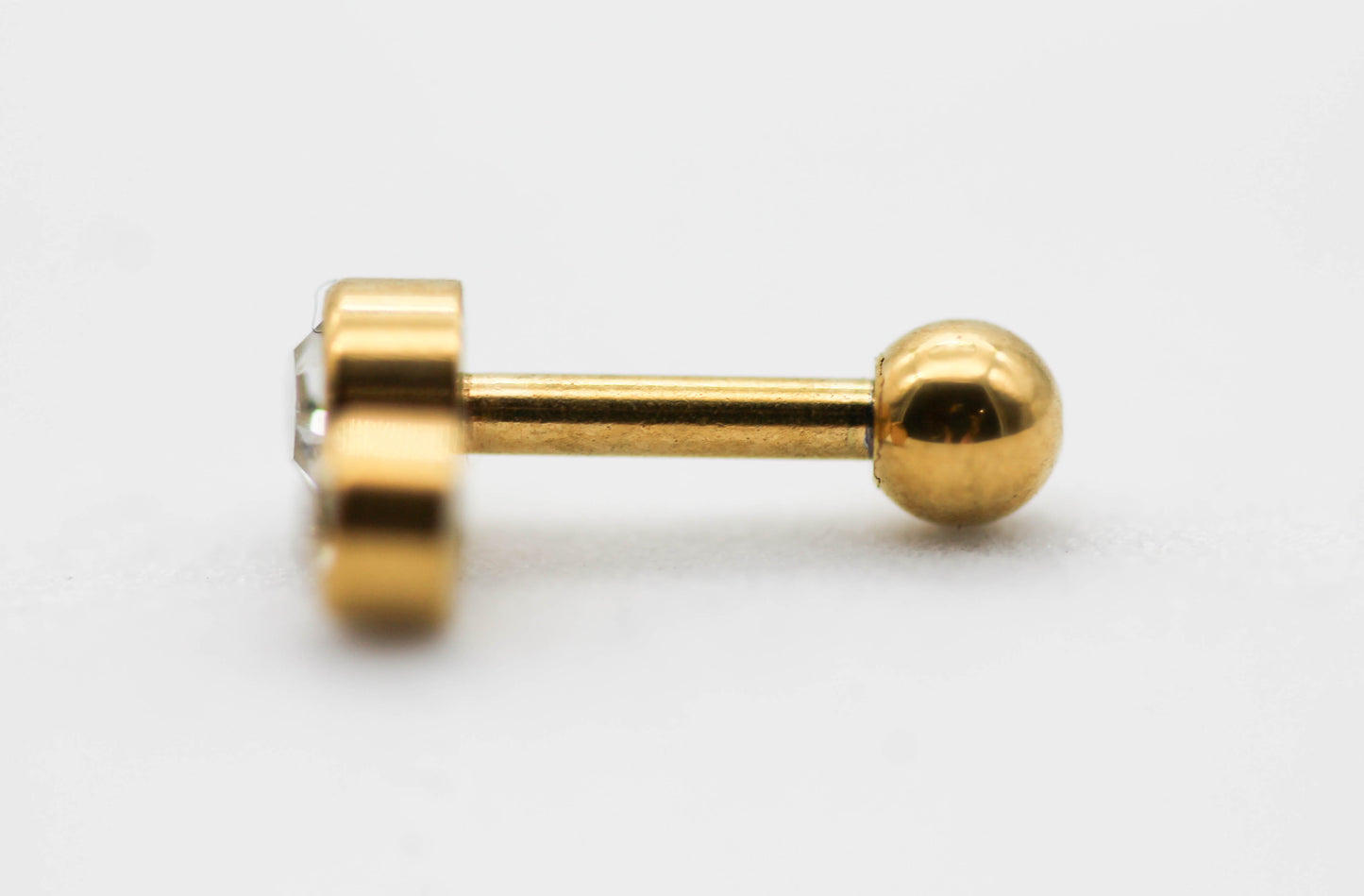 PIERCING DOBLE CIRCULO CH-G CIRCONIA 7MM; TONO DORADO