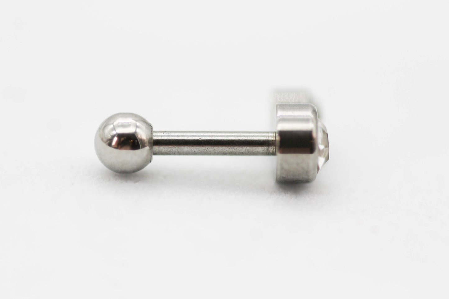 PIERCING DOBLE CIRCULO CH-G CIRCONIA 7MM; TONO PLATEADO