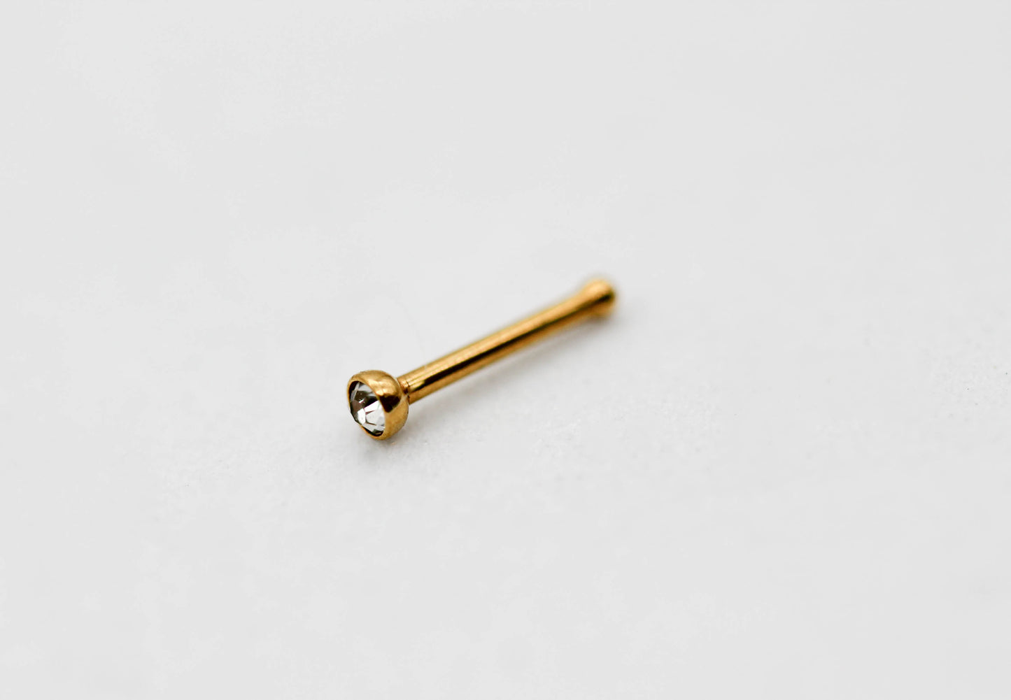 PIERCING NARIZ CIRCONIA 2MM; TONO DORADO