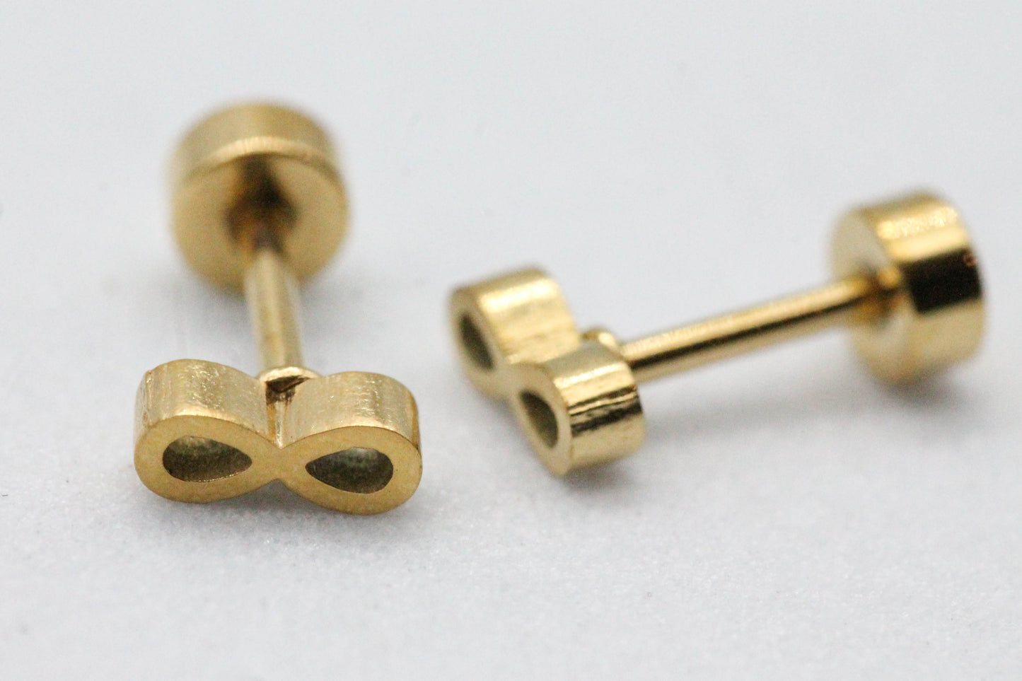 BROQUEL INFINITO CON TOPE DE ROSCA; TONO DORADO