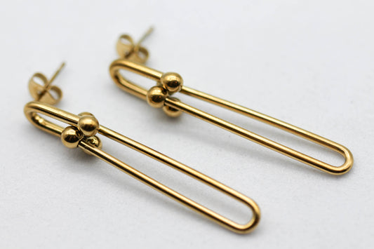 ARETES ESLABONES ESCALONADOS TFY 45MM; TONO DORADO