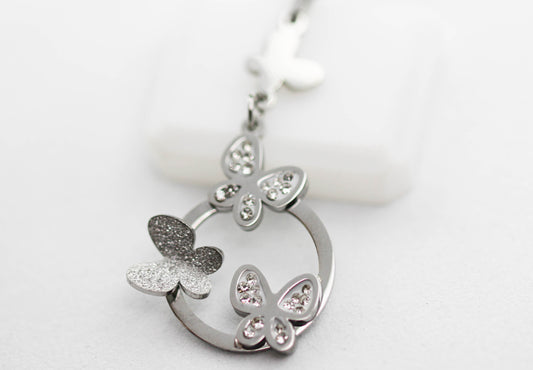 COLLAR MARIPOSA LISA/ CON CIRCONIAS, AZUCARADA EN CIRCULO HUECO 40MM, 40CM + EXTENSION 5.5CM; TONO PLATEADO