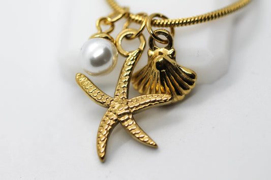 COLLAR DIJES PERLA, CONCHA Y ESTRELLA DE MAR; CADENA COLA DE RATON 40CMS + 6CMS DE EXTENSION; TONO DORADO