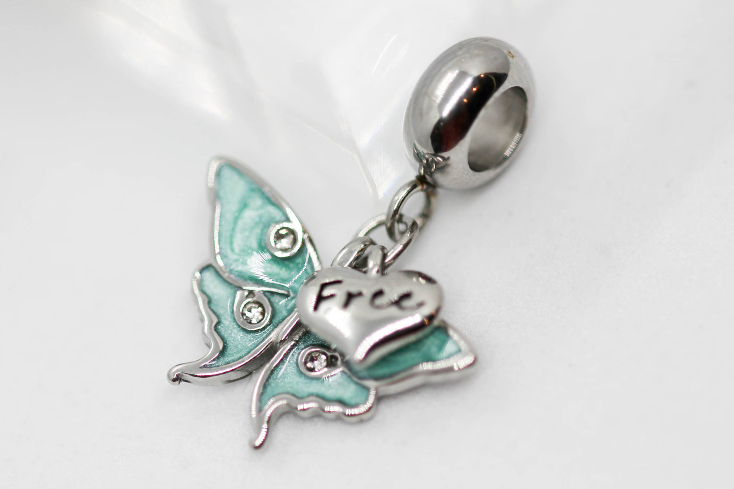 CHARM MARIPOSA COLGANTE AZUL AQUA 4 CIRCONIAS CORAZON "FREE"