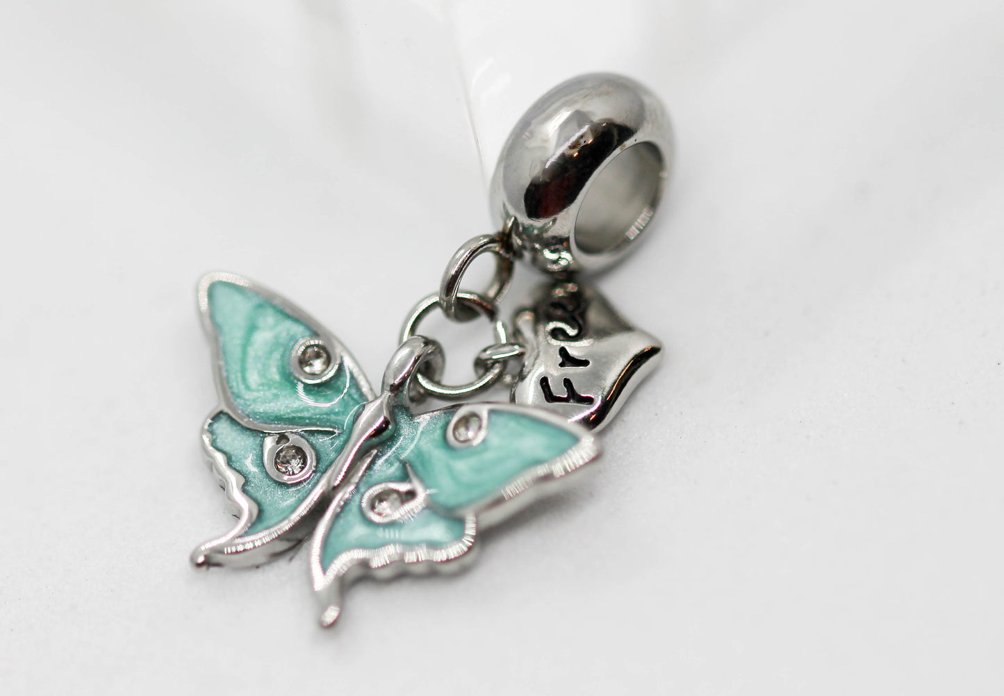 CHARM MARIPOSA COLGANTE AZUL AQUA 4 CIRCONIAS CORAZON "FREE"