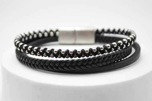 PULSERA CABALLERO 3-1 LISA, TRENZA, ESFERAS PLATEADAS EN HILO NEGRO 21CM