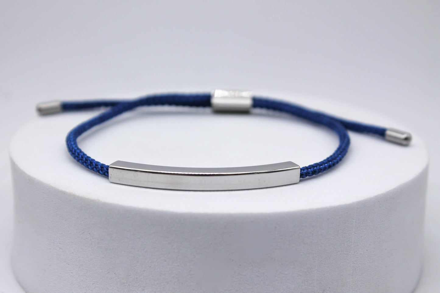 PULSERA UNISEX AJUSTABLE CORDON AZUL; TONO PLATEADO