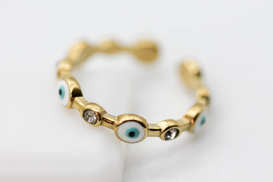 ANILLO OJOS AZULES/ CIRCONIAS AJUSTABLE; TONO DORADO