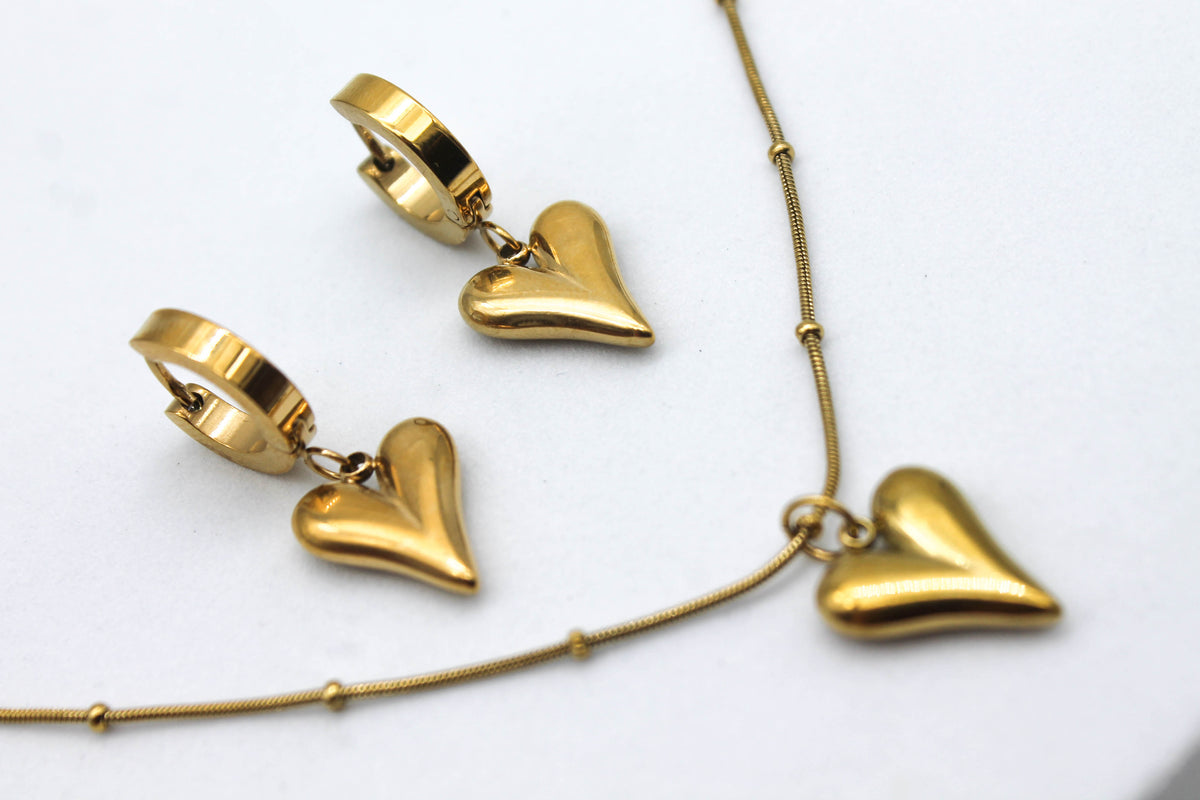 SET CORAZONES 3D HUGGIES CADENA ESFERITAS; TONO DORADO