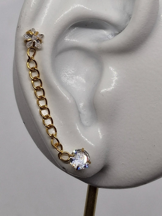 PIERCING DOBLE CIRCONIAS 5MM Y ESTRELLA UNIDAS CON CADENA; TONO DORADO