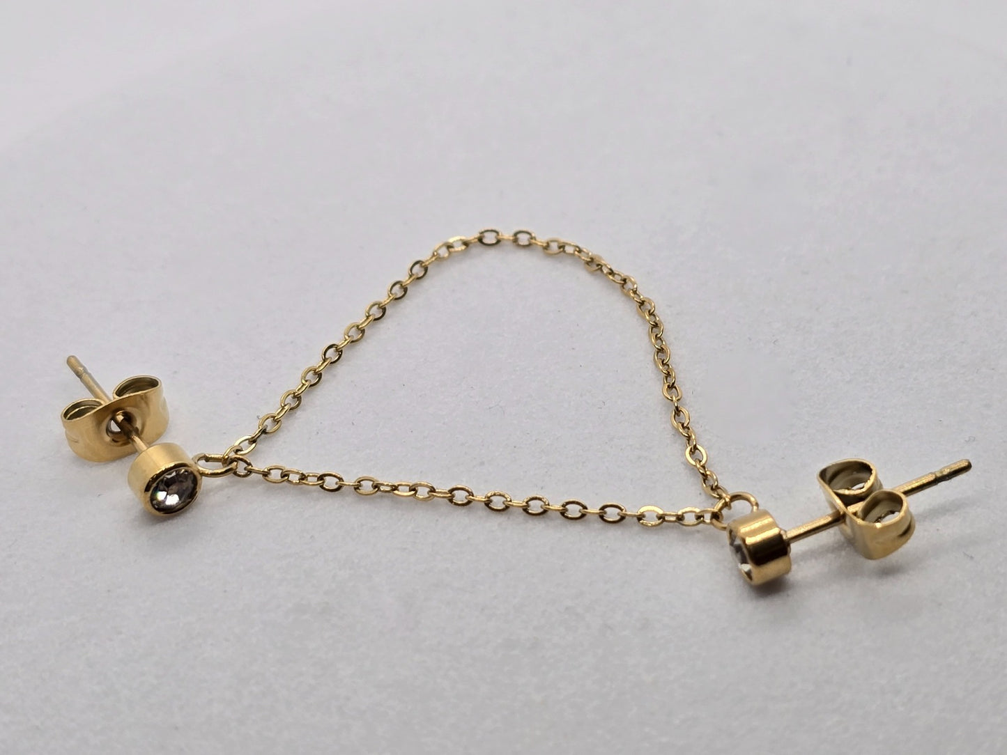 *ARETE / PIERCING DOBLE CON CADENAS CIRCONIAS BLANCAS*