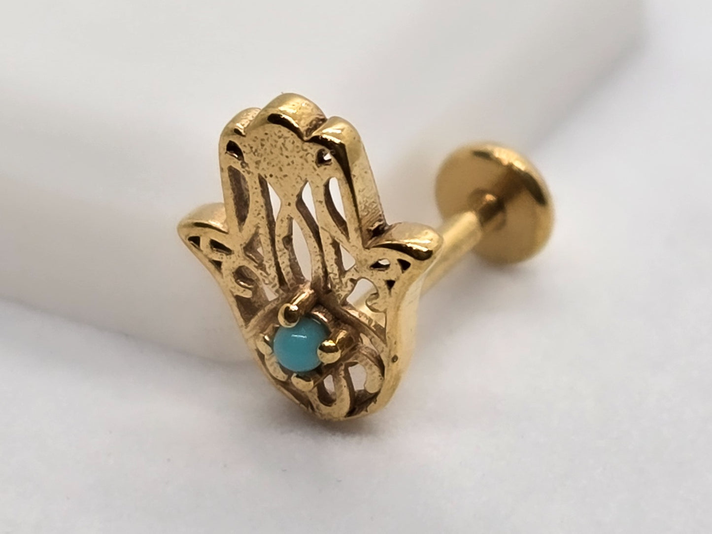 PIERCING MANO FATIMA PIEDRA AZUL 8X6MM; TONO DORADO