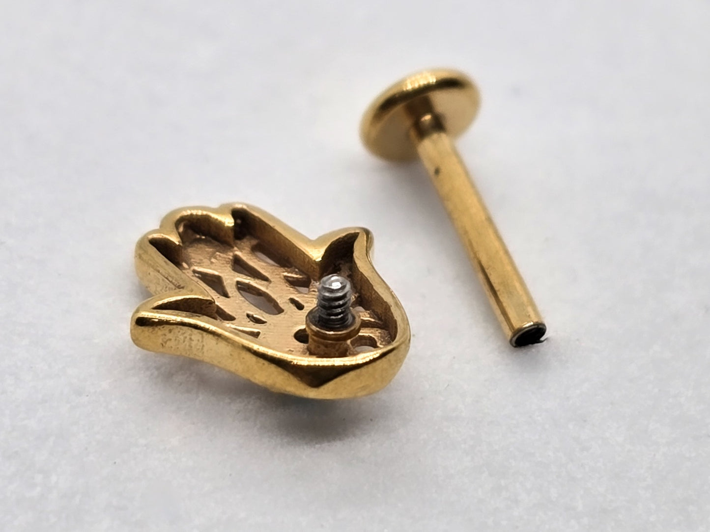 PIERCING MANO FATIMA PIEDRA AZUL 8X6MM; TONO DORADO