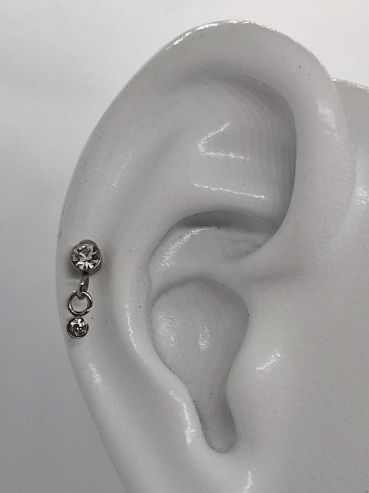 PIERCING DOBLE CIRCONIA; TONO PLATEADO