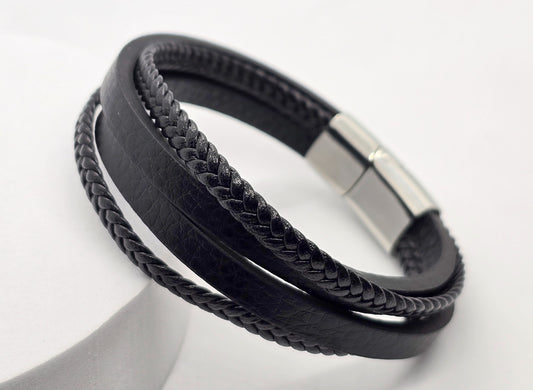 PULSERA CABALLERO CUATRO TIRAS DOS PLANAS DOS TRENZADAS BROCHE ACERO; TONO PLATEADO