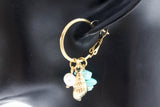ARRACADAS DIJE CARACOLA, PERLA Y PIEDRAS AZUL, TONO DORADO
