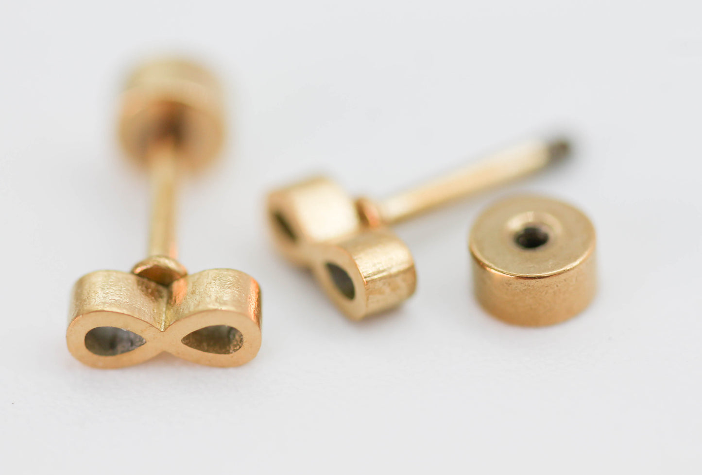 BROQUEL INFINITO CON TOPE DE ROSCA; TONO DORADO